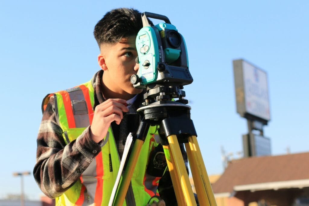 Construction building surveyor reviewing site plan for pre-construction work